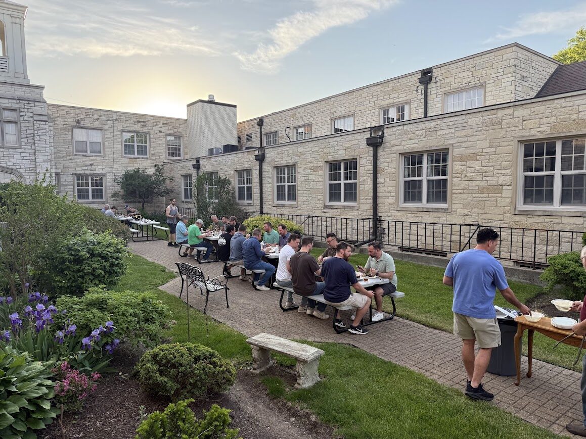 Men eating outdoors
